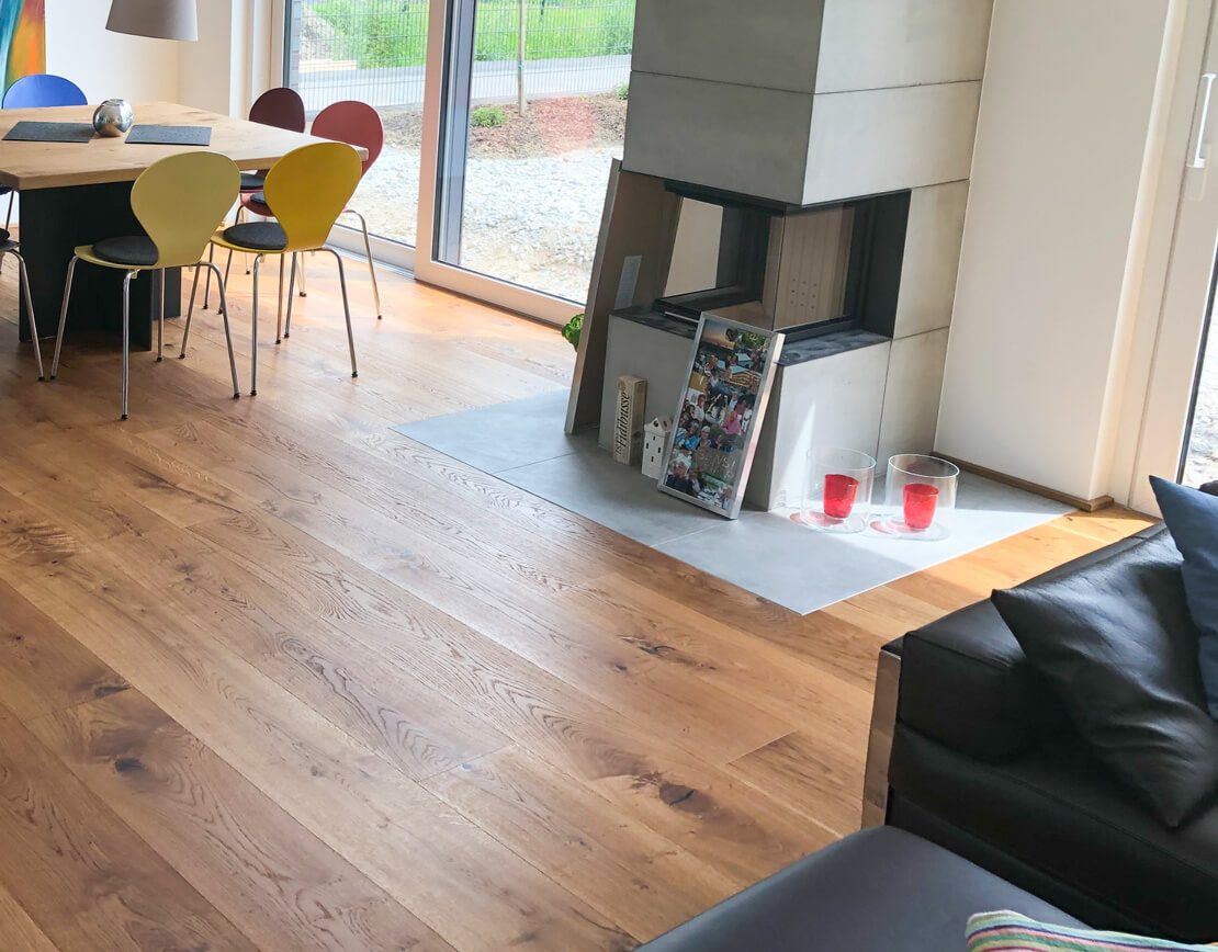 Referenz: Echtholzboden rund um den Kamin | HolzLand Beese in Unna